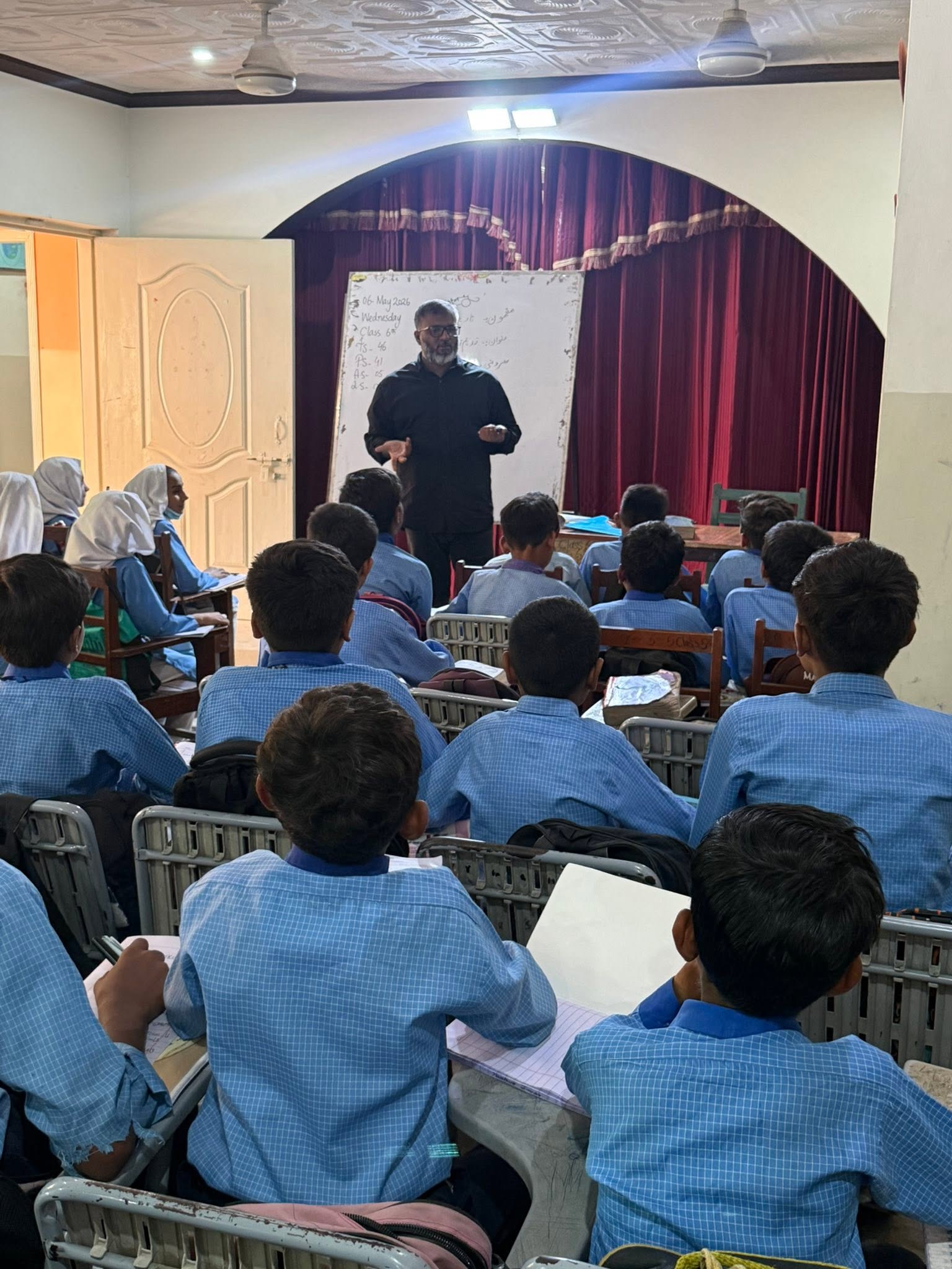 Students in an assembly hall at Grace Charity School