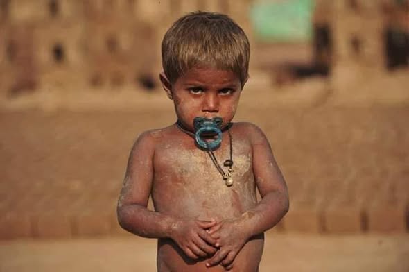 A child from a Pakistani brick-kiln community